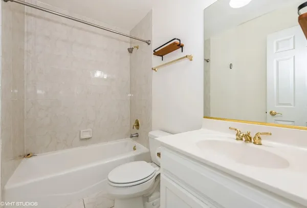 a bathroom with a sink a toilet and a bathtub