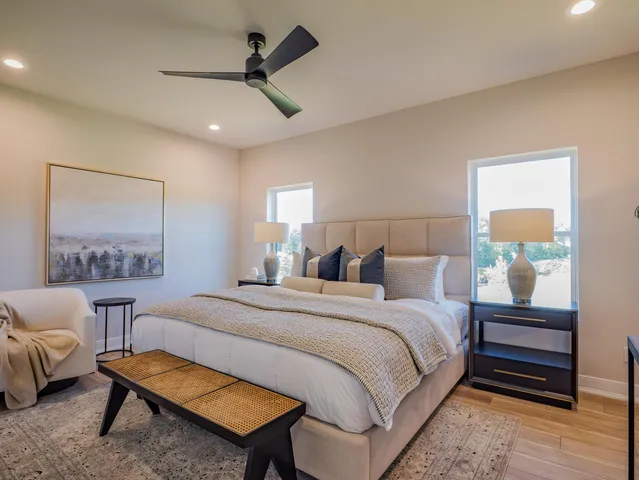 a bedroom with a bed and a couch