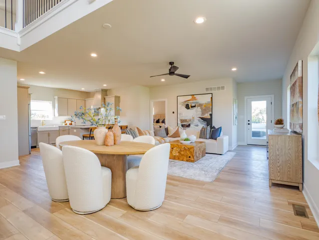 a living room with fireplace furniture and a wooden floor