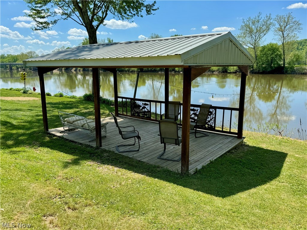 8551 South River Road Blue Rock, OH 43720 - Photo 7 of 43 Dock area featuring a deck with water view, a lawn, and a gazebo