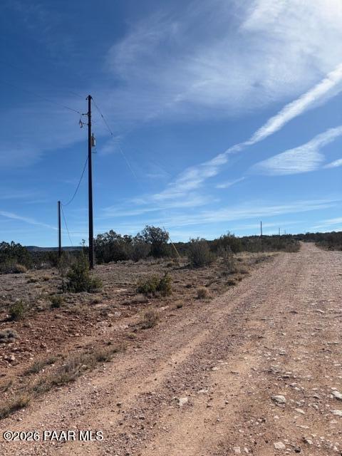 55991 North Bridge Canyon Road Seligman, AZ 86337 - Photo 9 of 12 a view of a city next to a dry yard