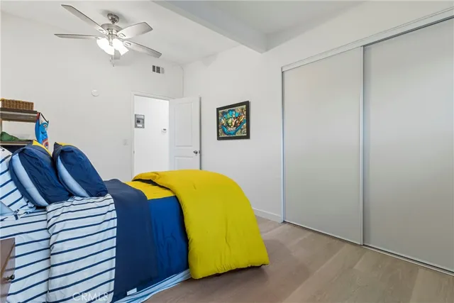 a view of a balcony with a floor to ceiling window and fire pit