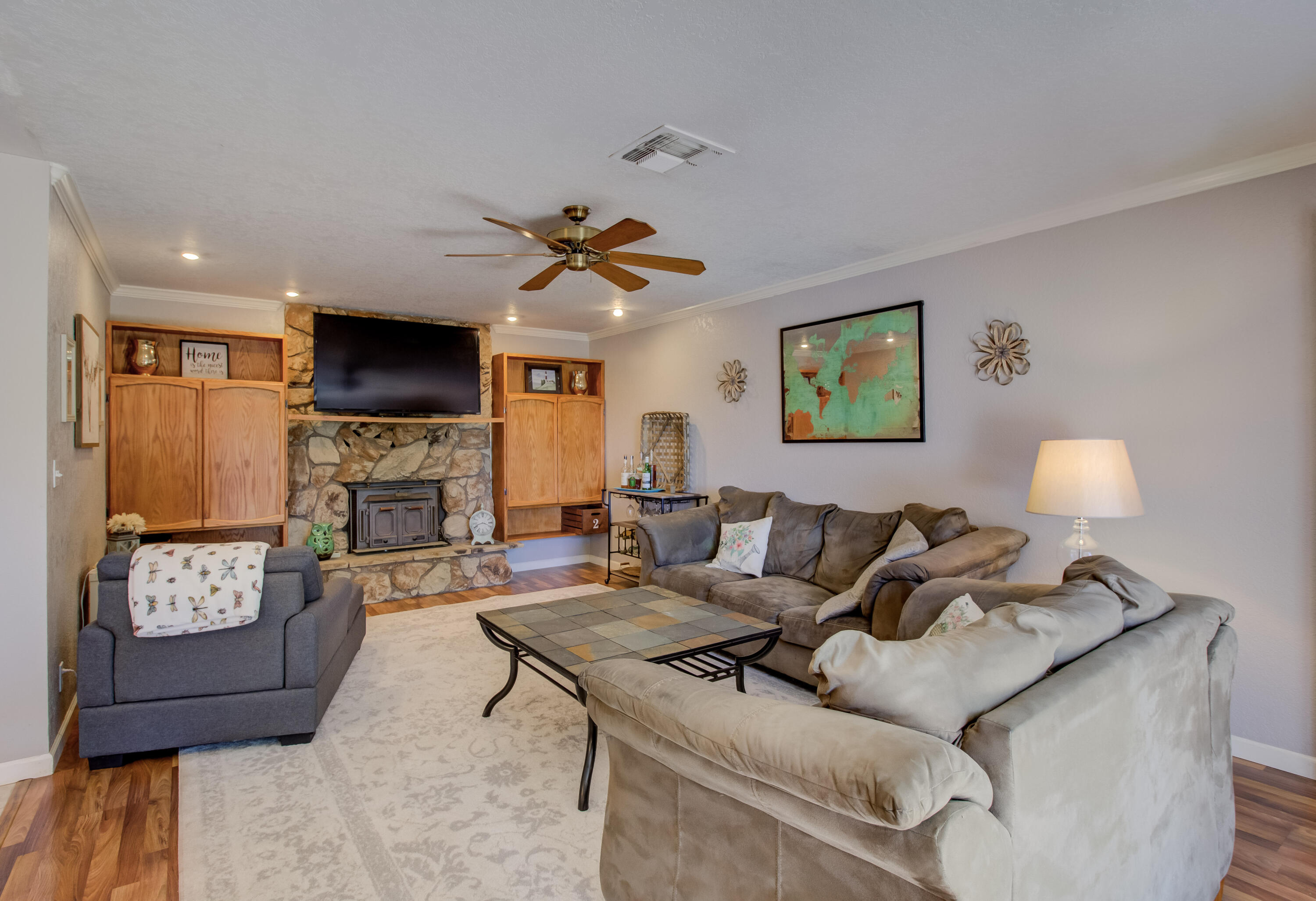 6250 Riverside Drive Redding, CA 96001 - Photo 15 of 28 a living room with furniture a fireplace and a flat screen tv