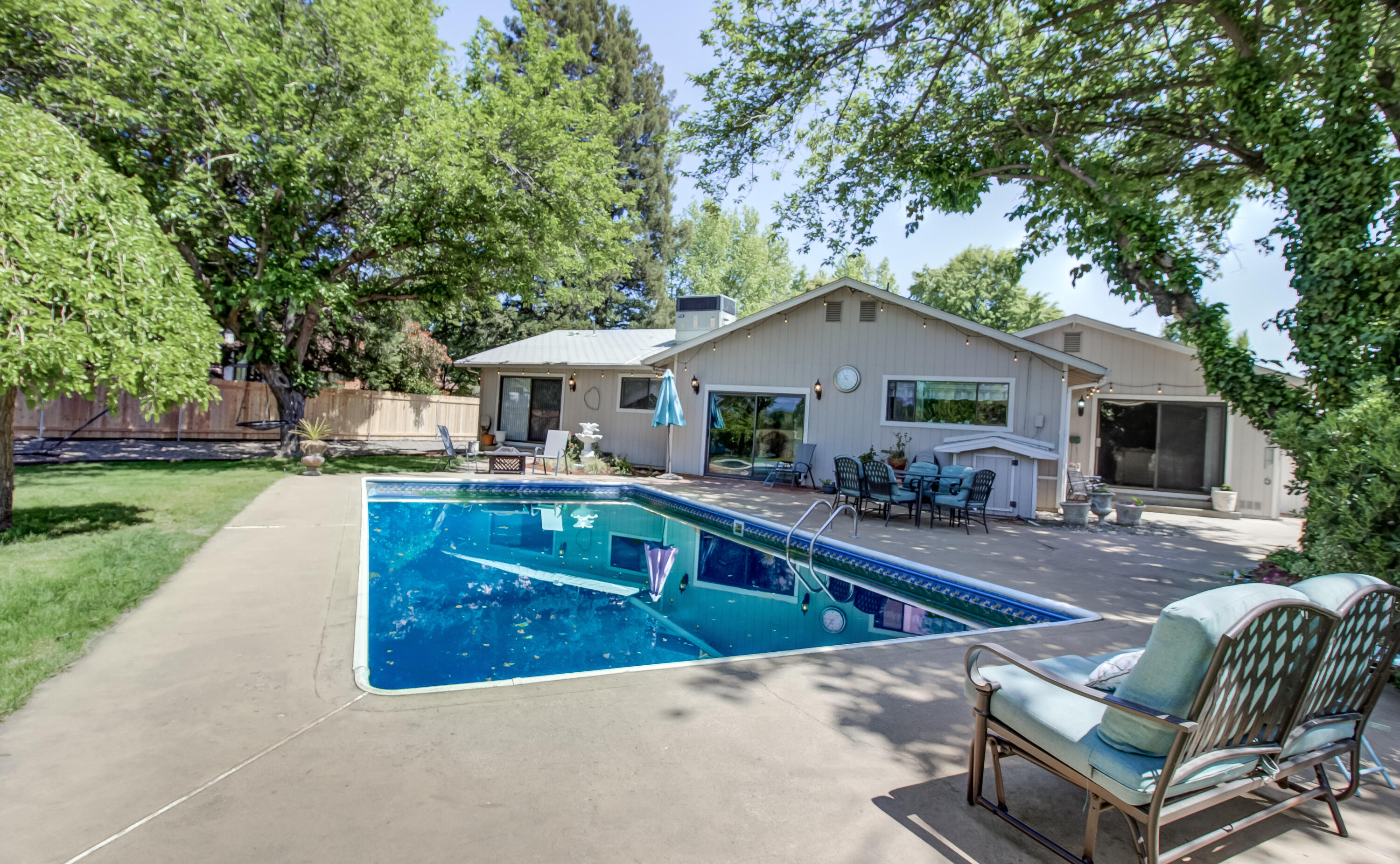 6250 Riverside Drive Redding, CA 96001 - Photo 21 of 28 a front view of house with yard outdoor seating and green space