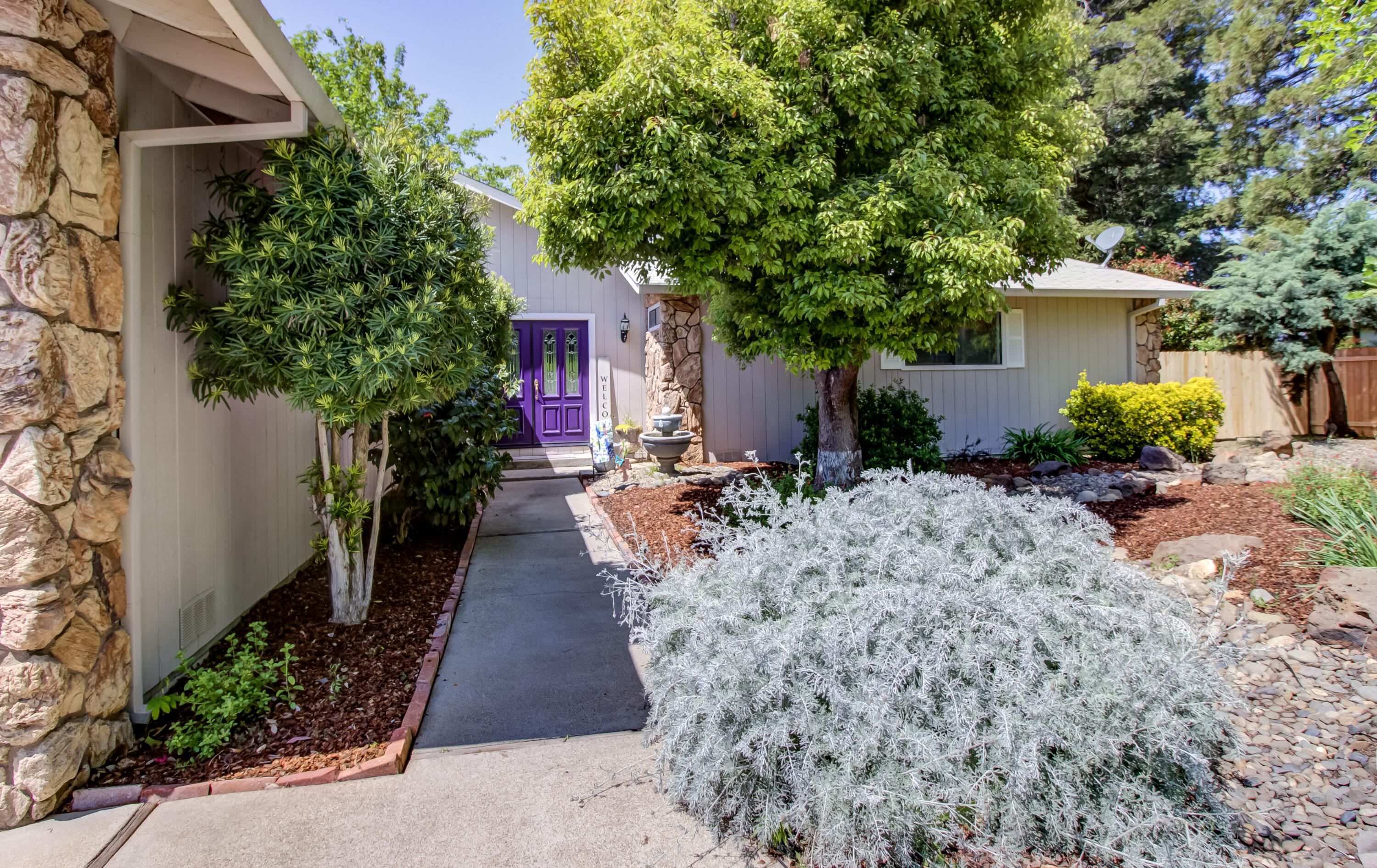 6250 Riverside Drive Redding, CA 96001 - Photo 4 of 28 a view of entryway with flower pots