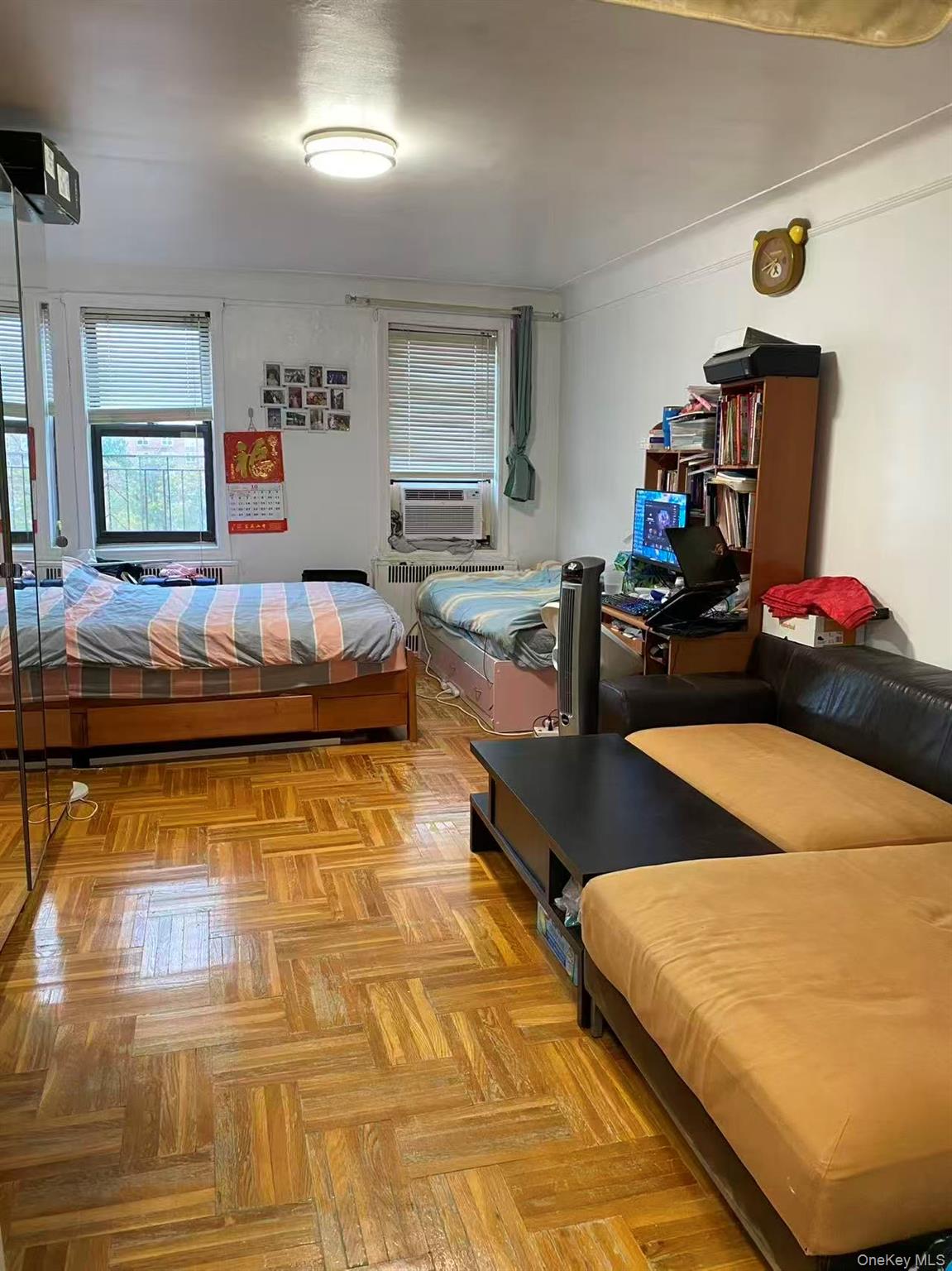 42-52 Layton Street, Unit 6F Queens, NY 11373 - Photo 3 of 10 a living room with furniture and a table