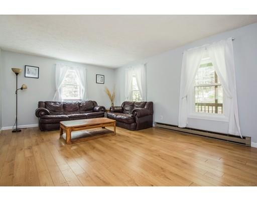 35 Breakneck Road Sturbridge, MA 01566 - Photo 6 of 30 a living room with furniture and a wooden floor