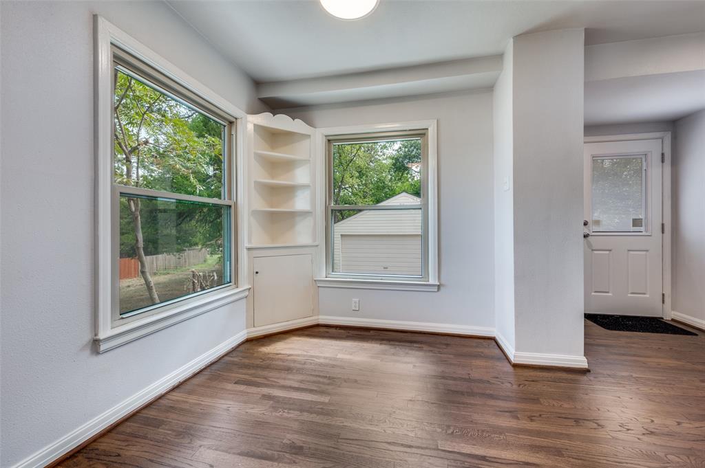 1342 Michigan Avenue Dallas, TX 75216 - Photo 16 of 25 Spare room with dark wood finished floors and baseboards