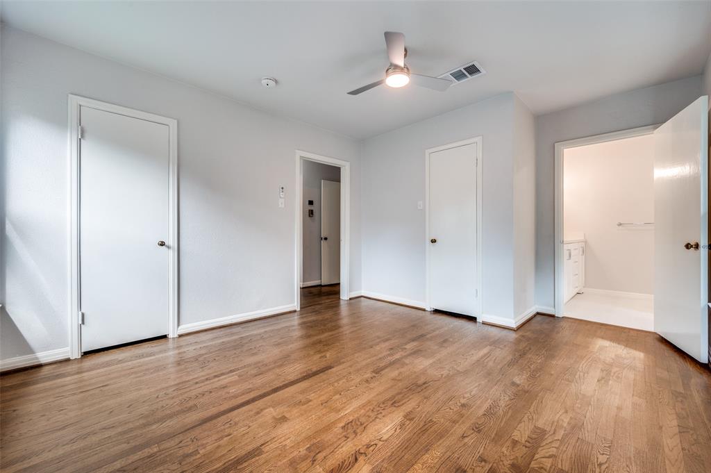 1342 Michigan Avenue Dallas, TX 75216 - Photo 18 of 25 Unfurnished bedroom featuring light wood-style floors, a ceiling fan, and ensuite bath