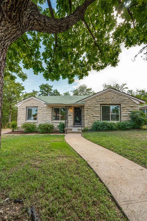 1342 Michigan Avenue Dallas, TX 75216 - Photo 2 of 25 Single story home featuring stone siding and a front lawn