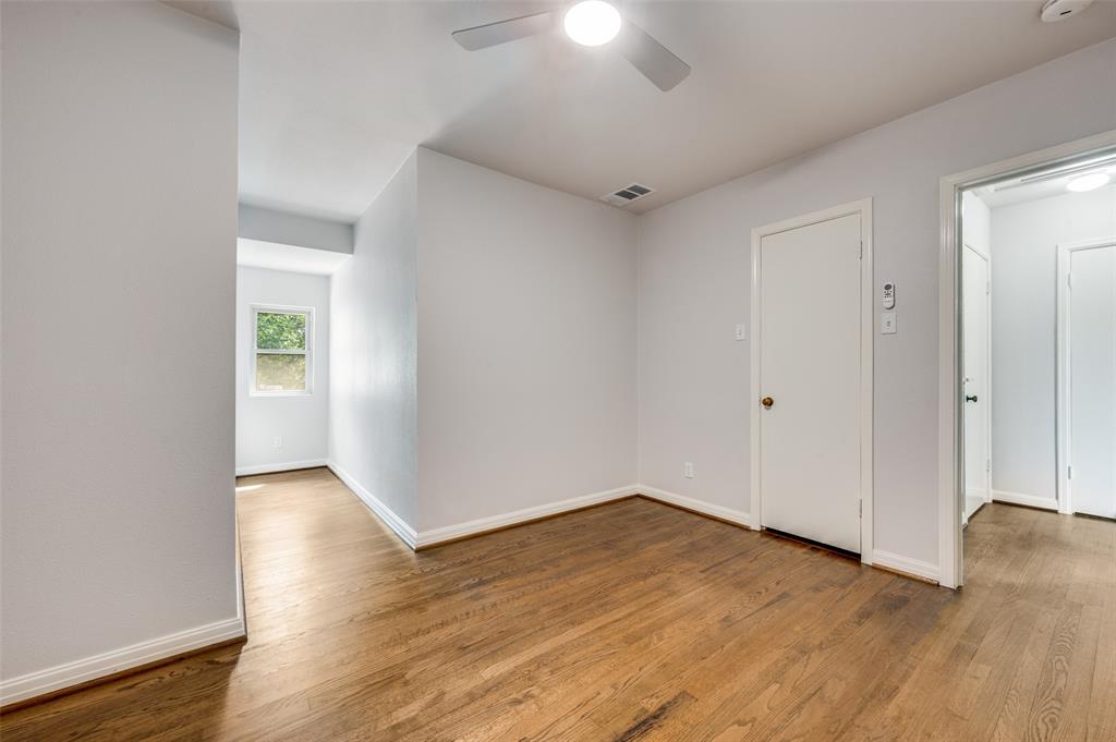 1342 Michigan Avenue Dallas, TX 75216 - Photo 22 of 25 Unfurnished room with wood finished floors and a ceiling fan
