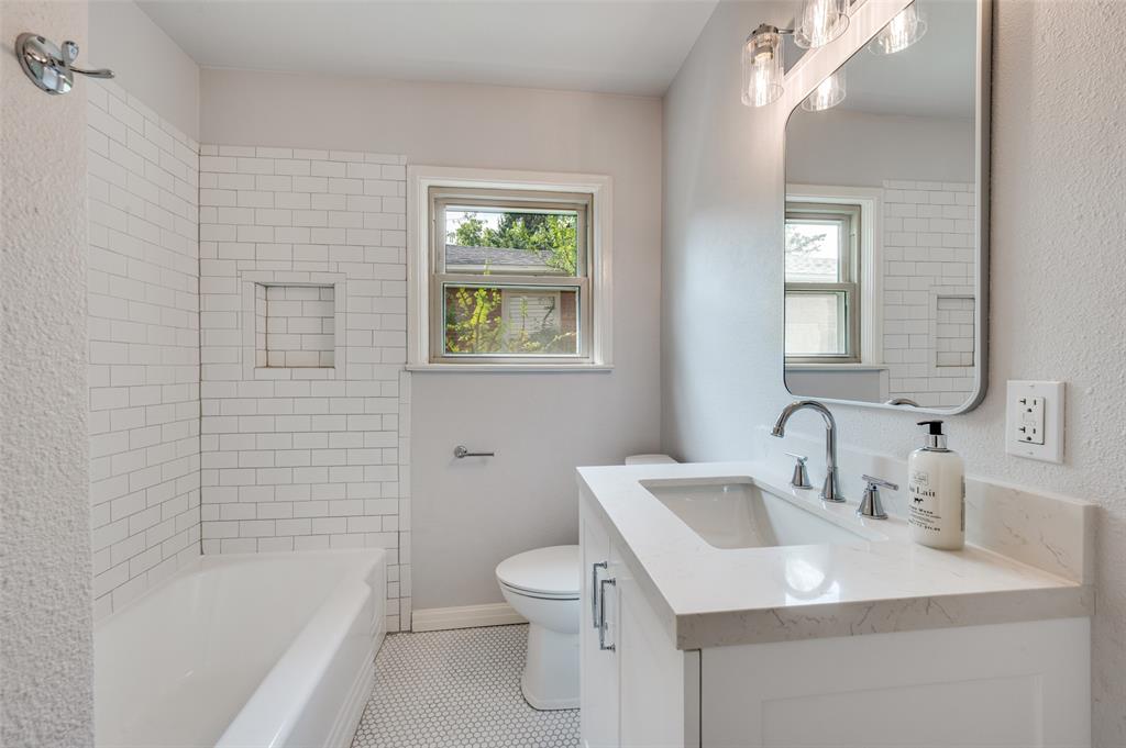 1342 Michigan Avenue Dallas, TX 75216 - Photo 23 of 25 Full bath featuring vanity, shower / bathtub combination, light tile patterned floors, and a textured wall