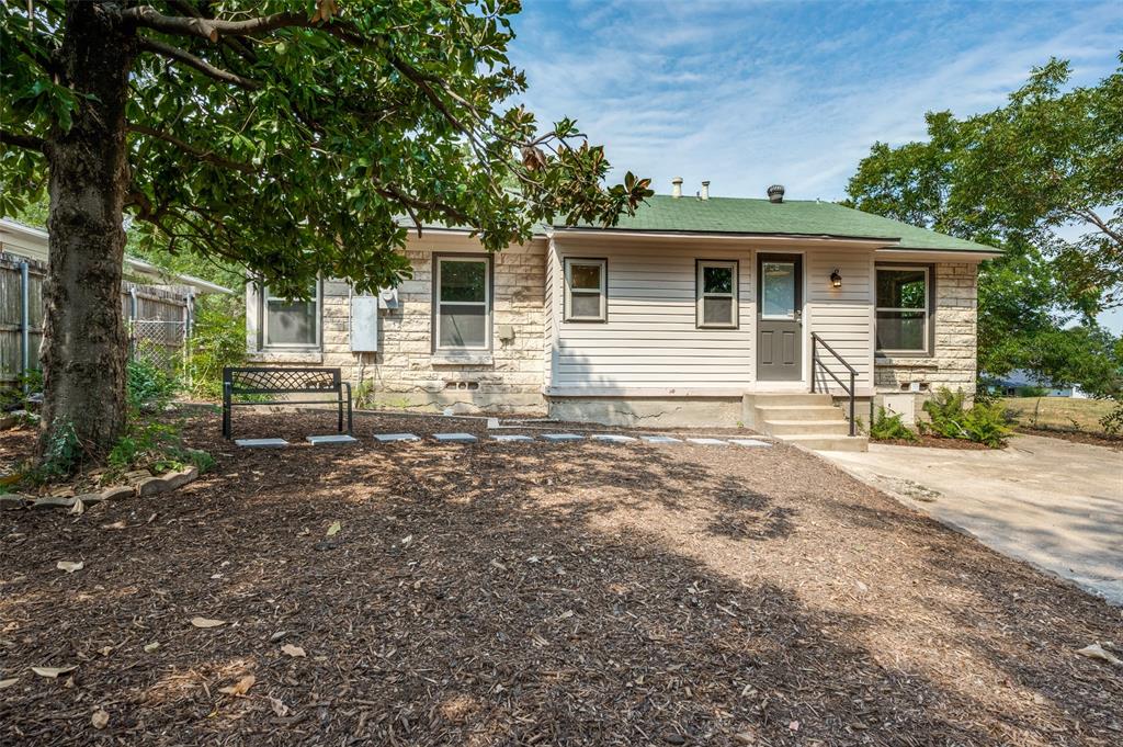 1342 Michigan Avenue Dallas, TX 75216 - Photo 25 of 25 View of front of home featuring stone siding and roof with shingles