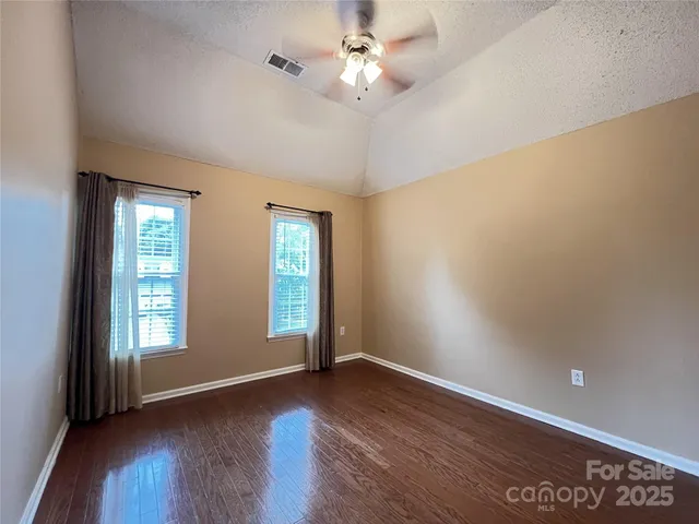 a view of a city with lush green forest