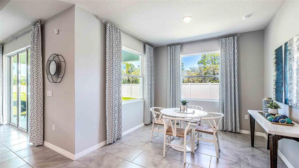 8072 Southwest 59th Terrace Ocala, FL 34476 - Photo 8 of 21 a dining room with furniture and window