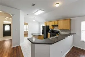 a kitchen with sink and window