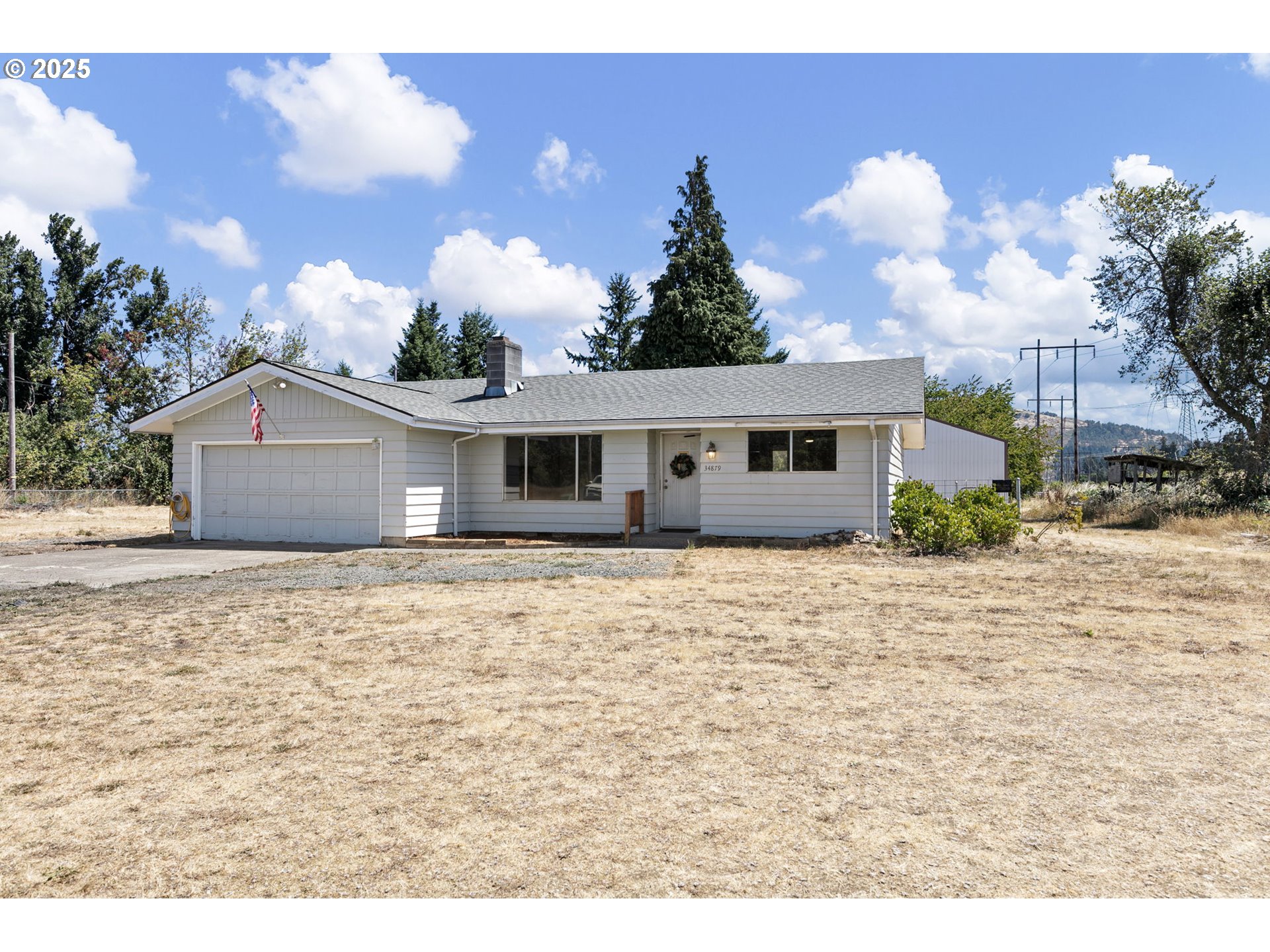 34879 Seavey Loop Road Eugene, OR 97405 - Photo 1 of 34 a backyard of a house with table and chairs