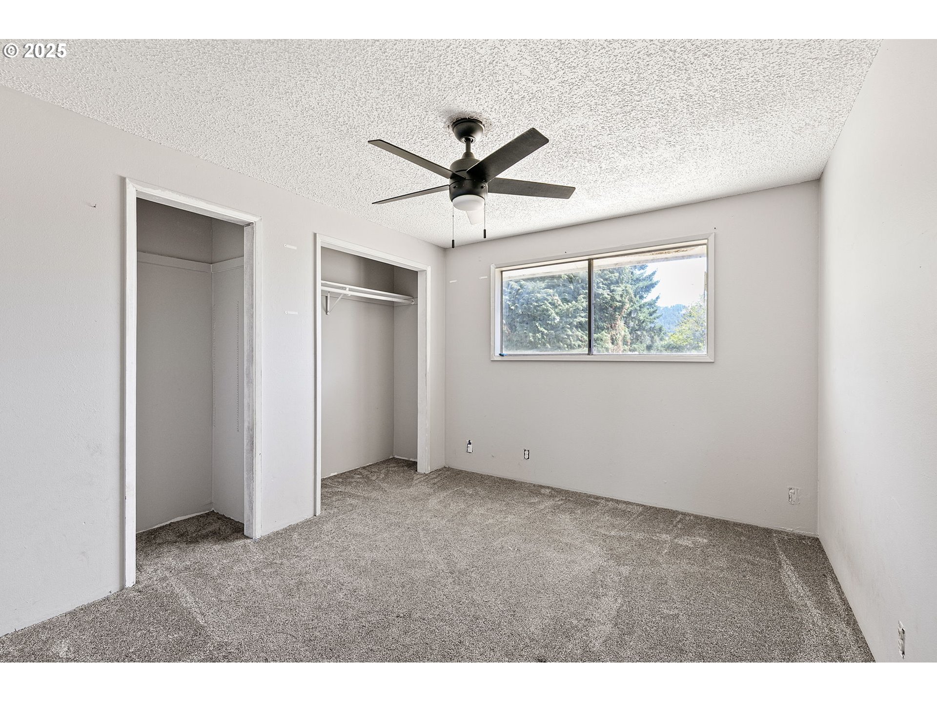 34879 Seavey Loop Road Eugene, OR 97405 - Photo 13 of 34 a view of an empty room with a window