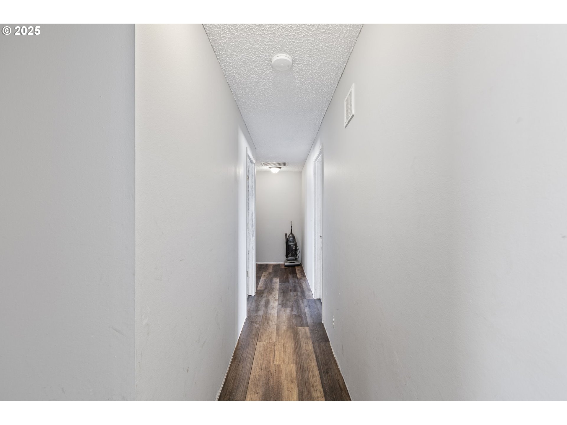 34879 Seavey Loop Road Eugene, OR 97405 - Photo 17 of 34 a view of a hallway with wooden floor