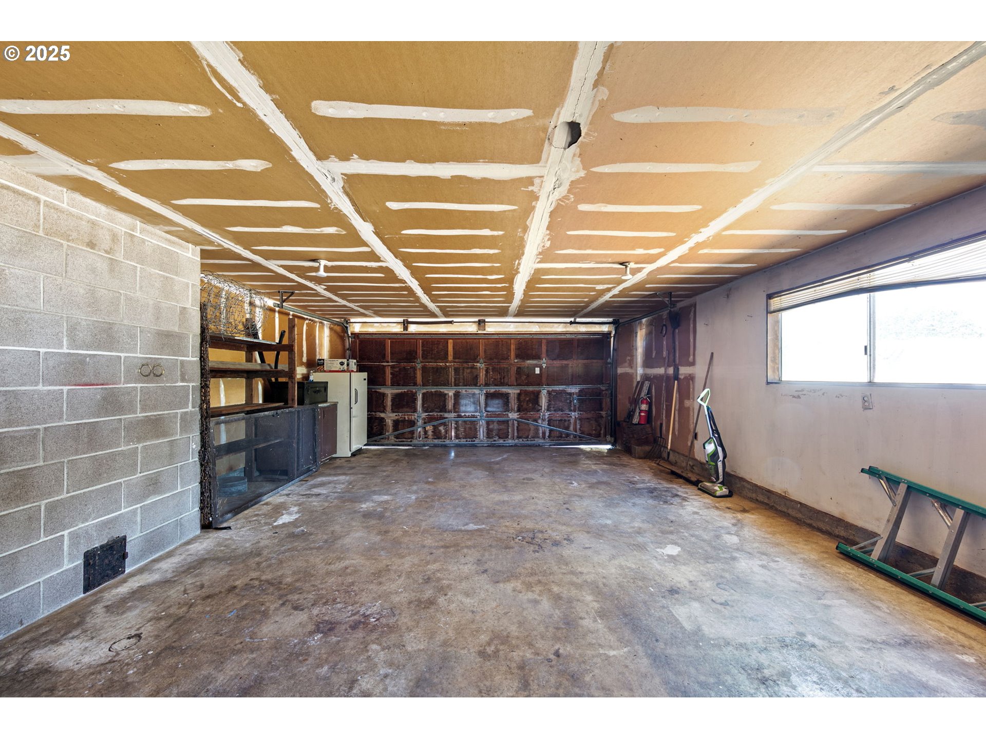 34879 Seavey Loop Road Eugene, OR 97405 - Photo 22 of 34 a view of an empty room with windows