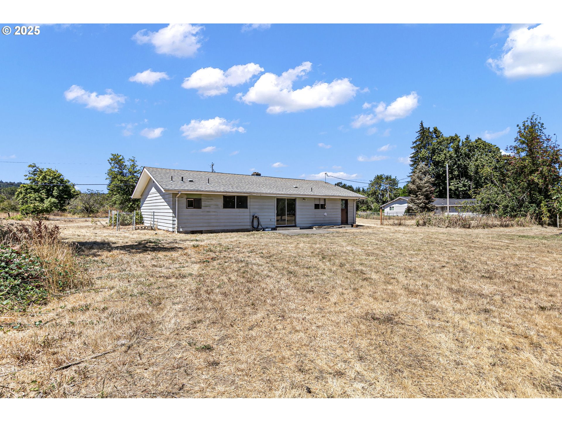 34879 Seavey Loop Road Eugene, OR 97405 - Photo 24 of 34 a front view of a house with a yard