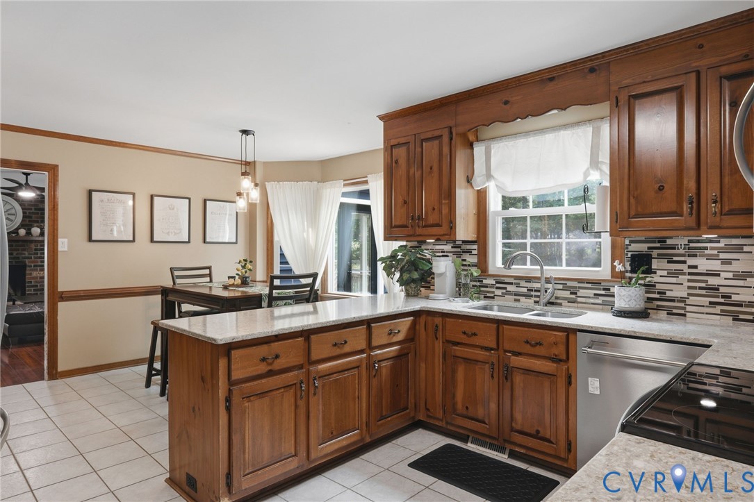 13232 Singer Road Midlothian, VA 23112 - Photo 14 of 44 Kitchen featuring wood cabinetry, light-toned coun