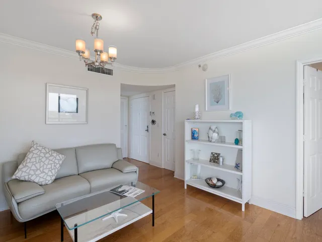 a kitchen with a refrigerator a sink and cabinets