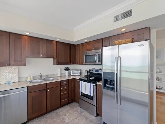 a bedroom with a large bed and a couch