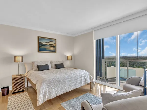 a bathroom with a sink toilet a mirror and shower