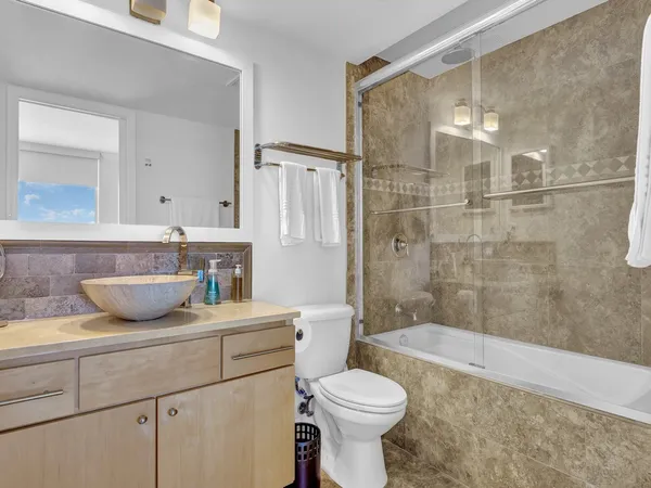 a living room with furniture rug and wooden floor