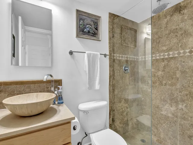 a view of a balcony with an outdoor seating