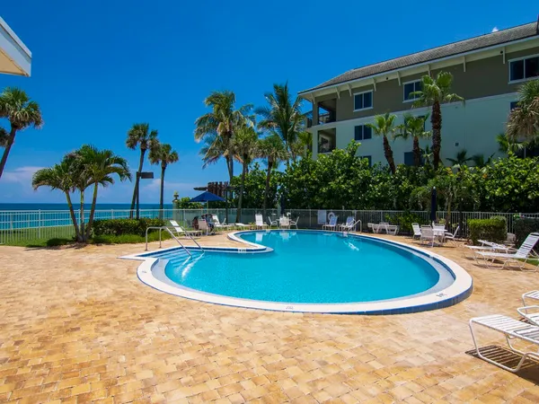 a view of swimming pool with outdoor seating