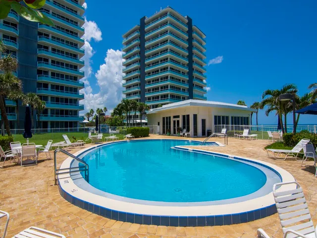 a view of a swimming pool with a yard