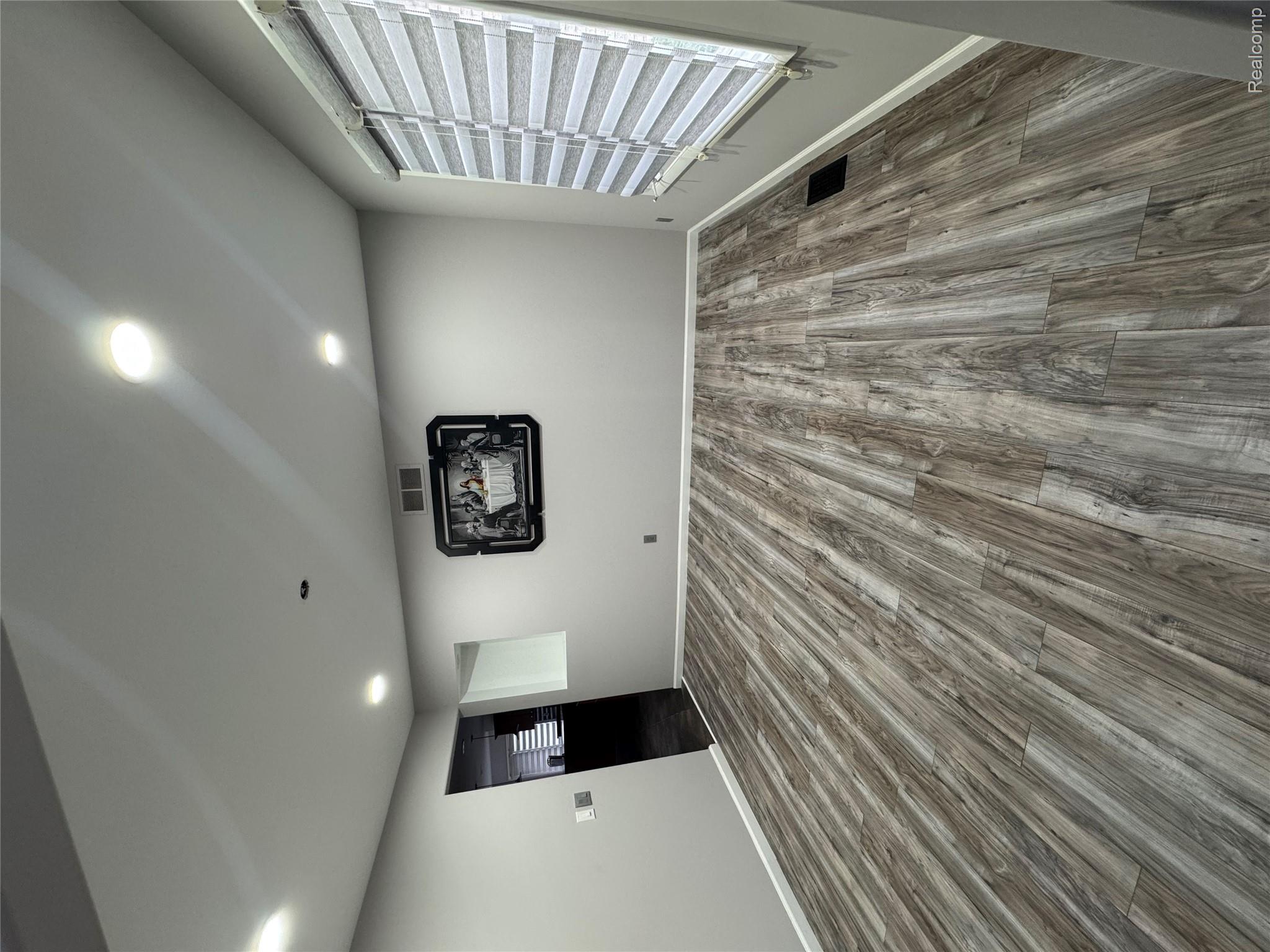 50493 Nesting Ridge Drive Macomb, MI 48044 - Photo 24 of 34 Basement with dark wood finished floors and recessed lighting