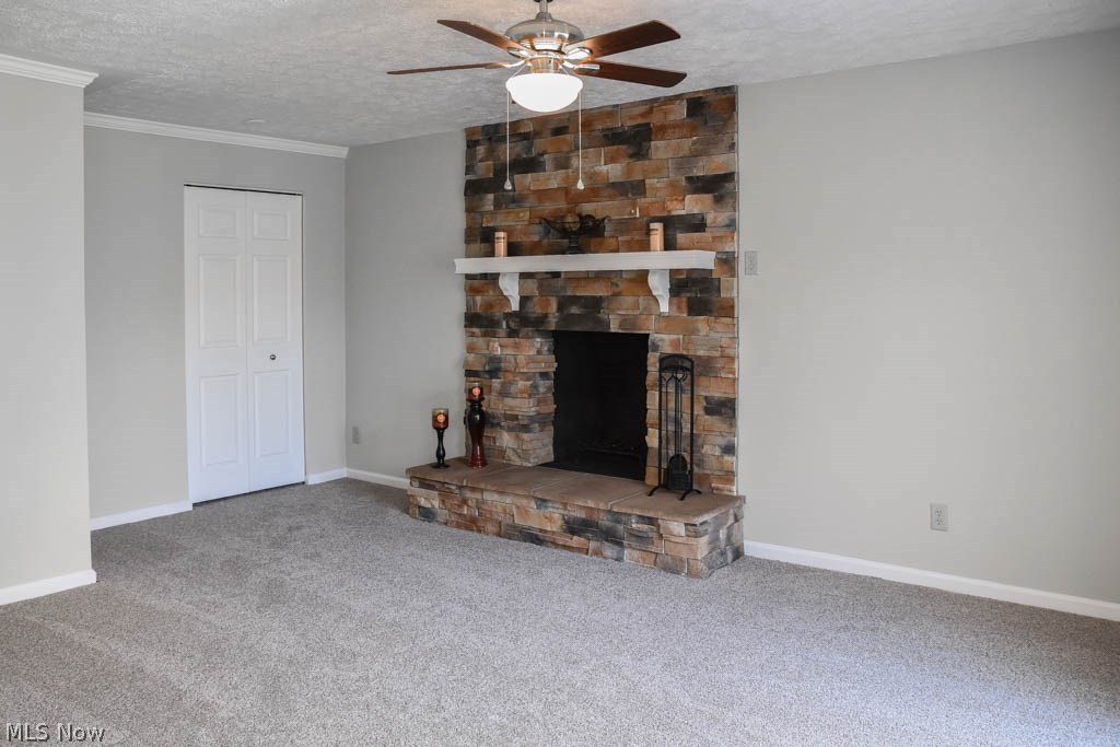 4612 Venus Road Uniontown, OH 44685 - Photo 3 of 21 Family room with a stone fireplace.