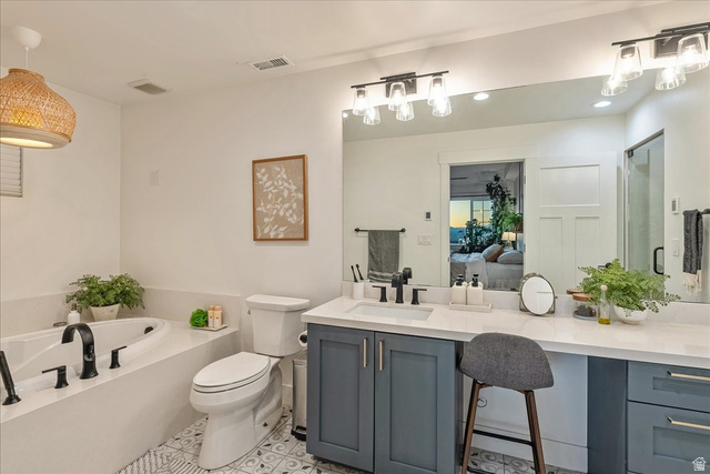1800 Spring Oaks Drive Springville, UT 84663 - Photo 55 of 68 Bathroom with vanity, a bath, a shower stall, connected bathroom, and light tile patterned floors