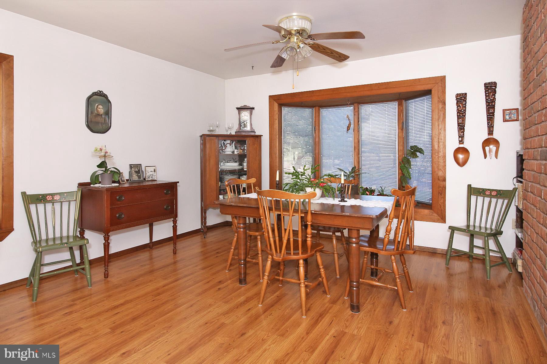 575 Bachmanville Road Hershey, PA 17033 - Photo 16 of 57 a view of a dining room with furniture window and wooden floor
