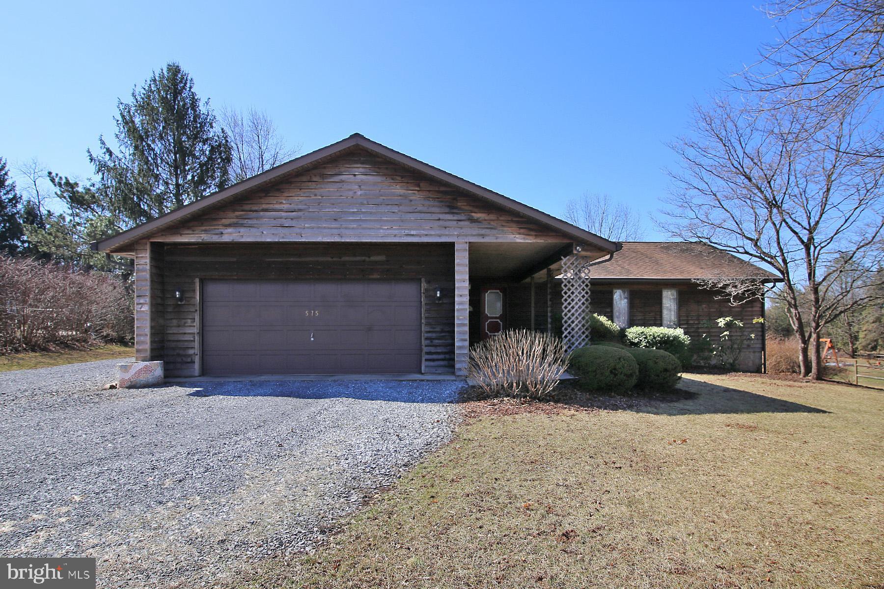 575 Bachmanville Road Hershey, PA 17033 - Photo 2 of 57 a front view of a house with a yard and garage