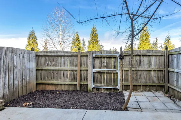 a view of outdoor space with wooden fence