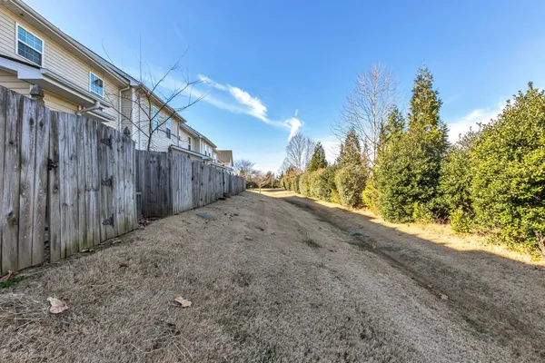 a view of a yard with potted plants