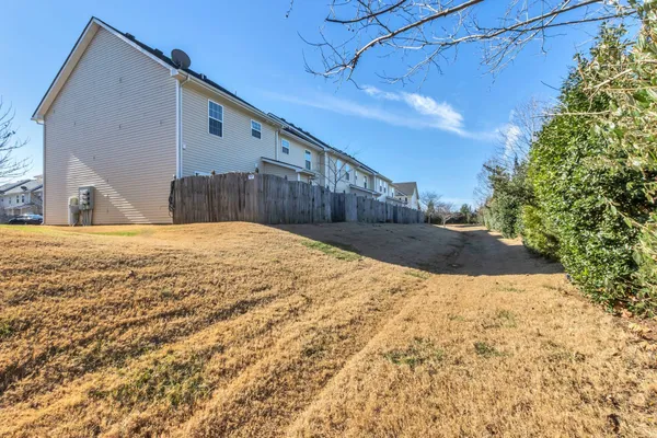 a view of a backyard of the house