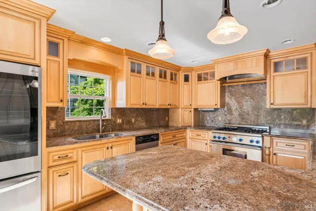 an empty room with windows and stairs