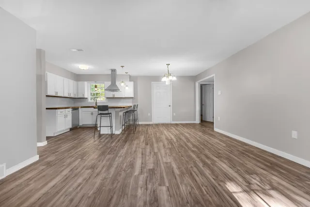 a view of kitchen with wooden floor