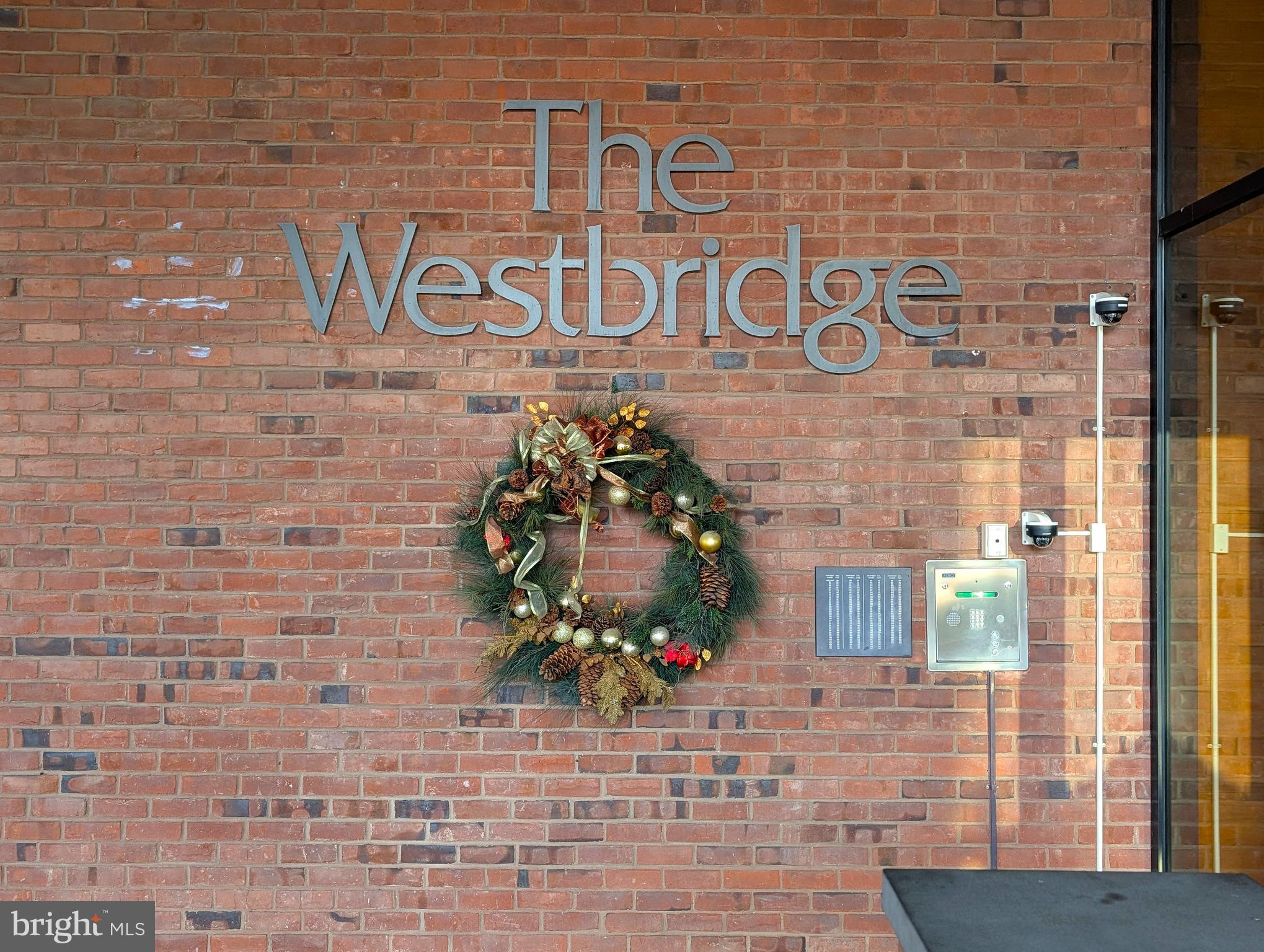 a sign that is on the brick wall