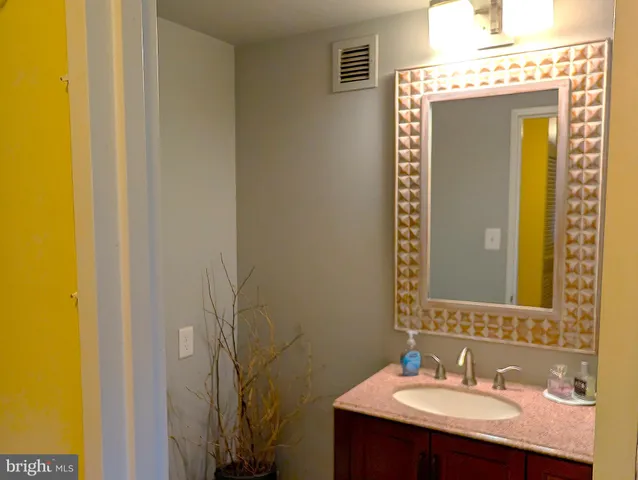 a bedroom with a bed and cabinets