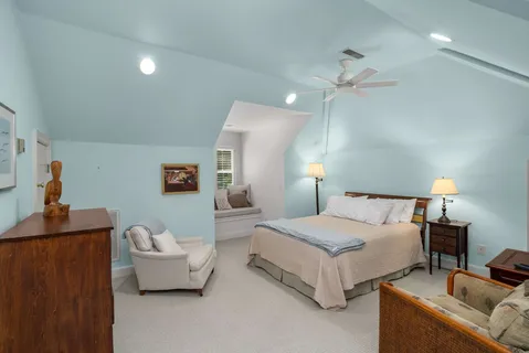 a view of livingroom with furniture and white cabinet