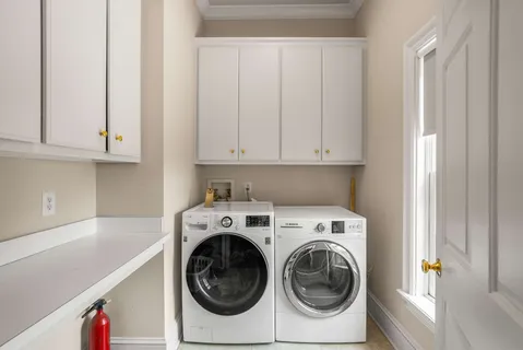 a view of an empty room with a floor to ceiling window and outdoor space