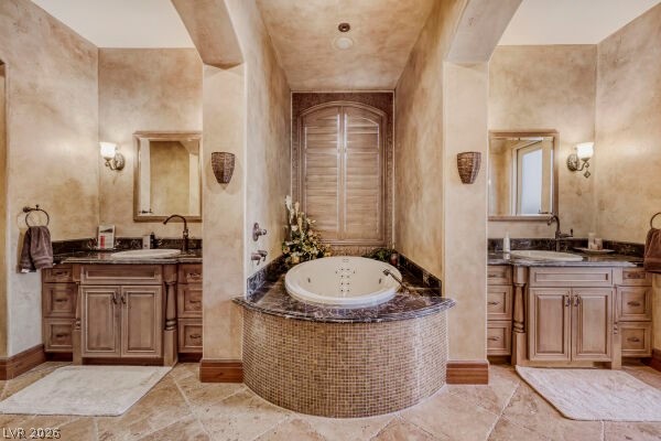 1065 Kratzer Circle Henderson, NV 89002 - Photo 24 of 62 Full bathroom featuring two vanities and a garden tub