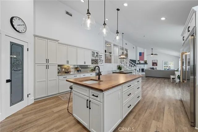 a living room with fireplace furniture and a flat screen tv