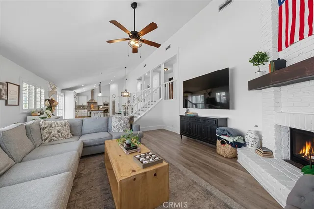 a bathroom with a granite countertop sink a mirror and a shower